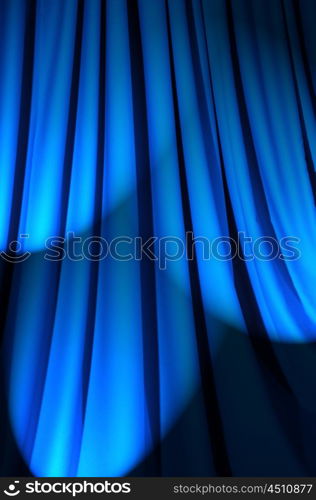 Brightly lit curtains in theatre concept