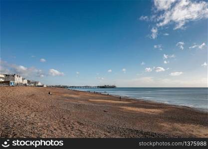 BRIGHTON, EAST SUSSEX/UK - JANUARY 3 : View of the beach and Pier in Brighton East Sussex on January 3, 2019. Unidentified people