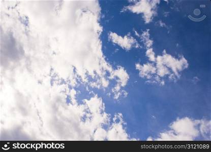 Brights clouds against a deep blue sky