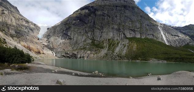 Briksdal glacier with mountain lake at over 1.200 meters enjoying quality time in nature