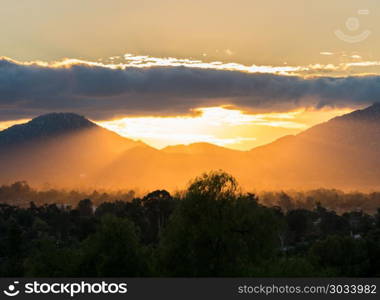 Brilliant sunset near Ramona in California. Sun setting behind mountains near to Ramona in the deserts of southern california. Brilliant sunset near Ramona in California