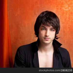 british indie pop rock look young man on orange brown retro background