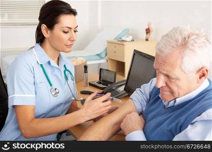 British nurse giving injection to senior man