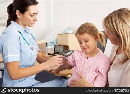 British nurse giving injection to young child