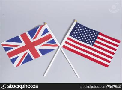 British (UK) and American flags on gray background