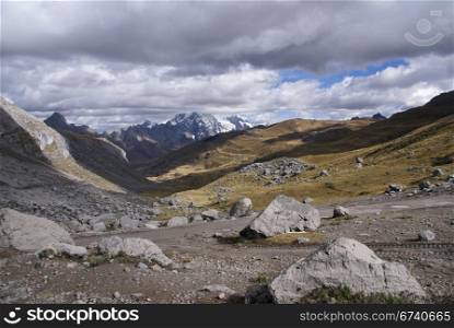Broad glacial valley with erratic granite boulders, Cordillera Huayhuash, Andes, Peru, South America