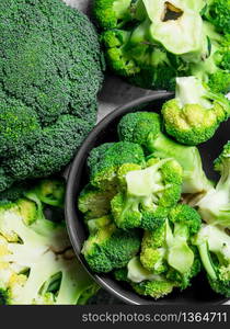 Broccoli in a bowl. On rustic background.. Broccoli in a bowl.