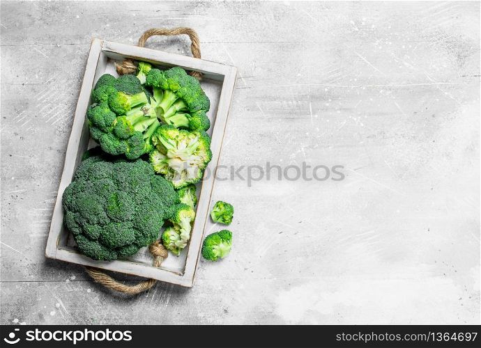 Broccoli on tray. On rustic background. Broccoli on tray.
