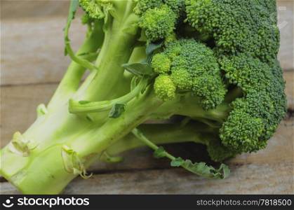 Broccoli on wooden background - detail