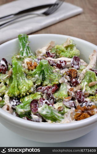 Broccoli salad with chicken, walnuts, sunflower seeds, cranberries and yogurt