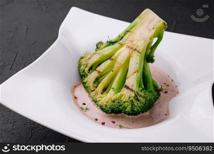 Broccoli steak with walnut sauce on plate