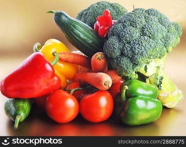 Broccoli, Tomatoes, carrots and cucumber lie on table