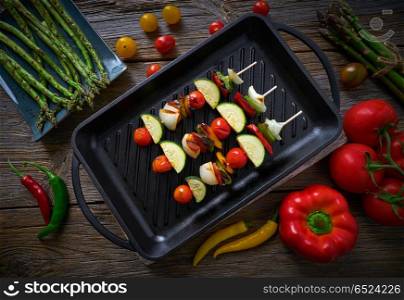 brochette grill with tomato onion pepper zucchini. brochette vegetable on grill pan with tomato onion pepper zucchini