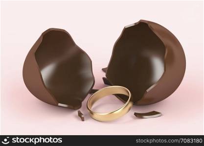 Broken chocolate egg with a surprise, golden engagement ring inside