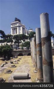 Broken columns in front of a building, Italy