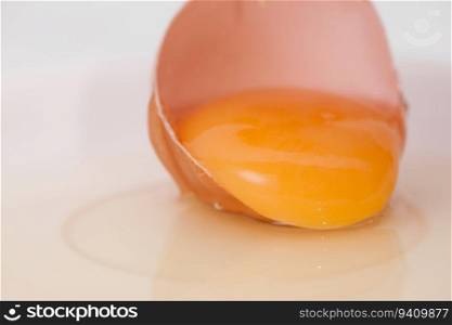 broken egg on white background close up. broken egg