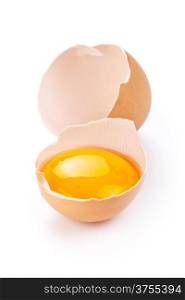 Broken egg with yolk and eggshell on white background