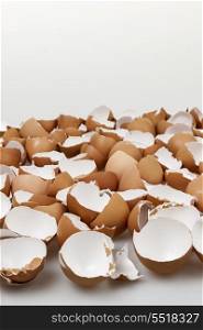 Broken eggshells. Pile of many broken brown empty eggshells