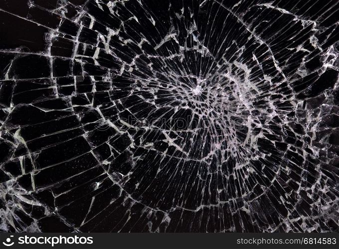 Broken glass, black background, concept of violence