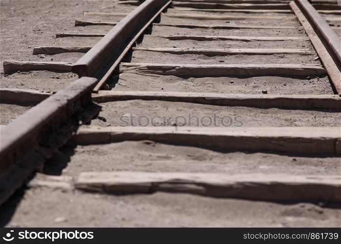 Broken rail for railroad by ghost town