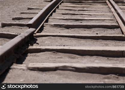 Broken rail for railroad by ghost town