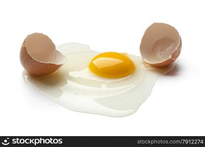 Broken raw egg on white background