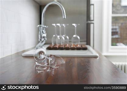 Broken wine glass on kitchen counter