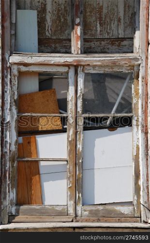 broken wooden window in a uninhabited building