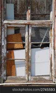 broken wooden window in a uninhabited building