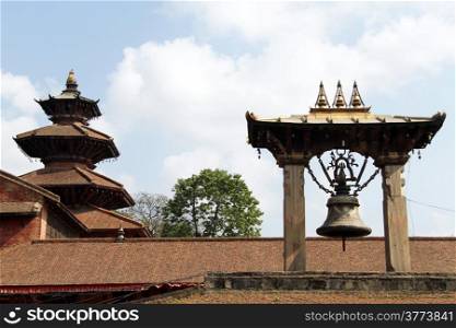 Bronze bell and roofs of pagoda in Patan, Nepal