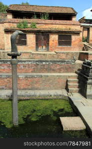 Bronze cobra amd water in fountain in king&rsquo;s palace in Bhaktapur, Nepal