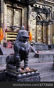 Bronze lion and golden door of temple Changu Narayan in Nepal