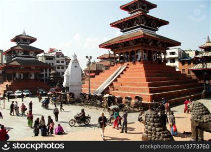 Bronze lions snd temples on the Durbar square in Khatmandu, Nepal