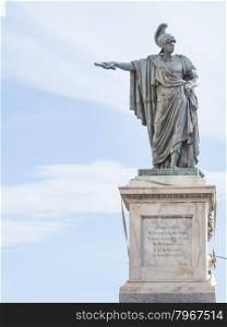 bronze statue indicate. In front of a bronze staure of Carlo Felice in Cagliari - Sardinia Italy