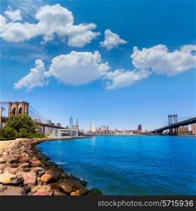 Brooklyn and Manhattan Bridges with New York city sunshine skyline US