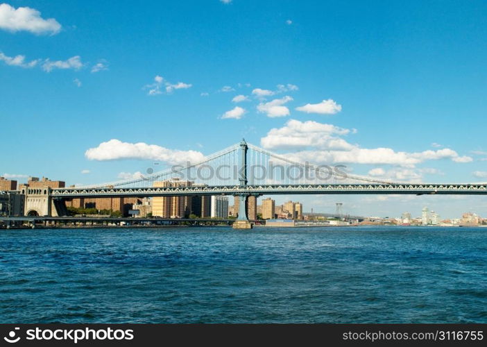 Brooklyn bridge in New York on bright summer day