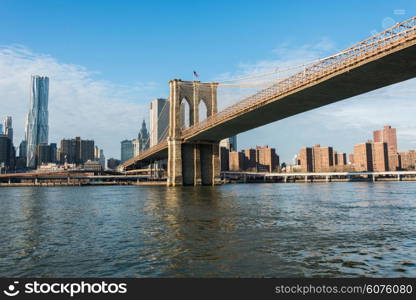 Brooklyn bridge in New York on bright summer day