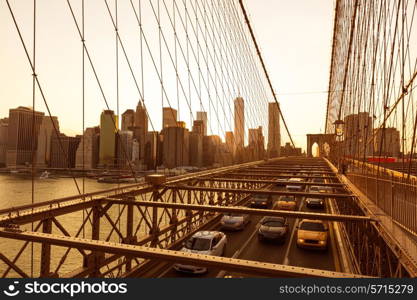 Brooklyn Bridge sunset with Manhattan skyline of New York City USA