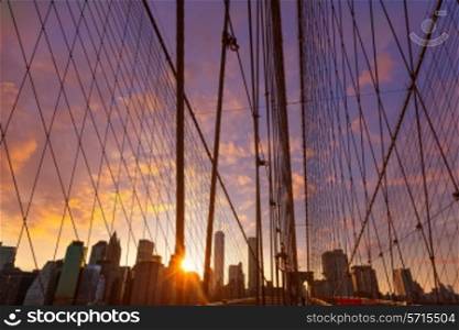 Brooklyn Bridge sunset with Manhattan skyline of New York City USA