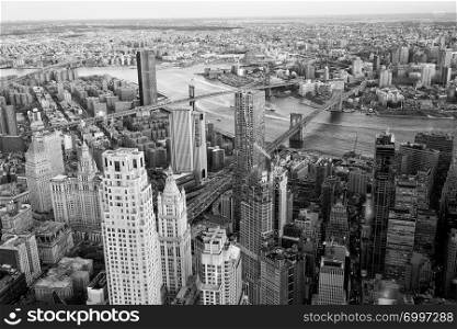 Brooklyn, Manhattan and Williamsburg Bridge at sunset, amazing aerial view of New York City - USA.