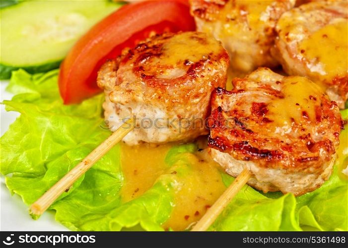 broshett- grilled fillet meat with bacon at skewer with vegetable