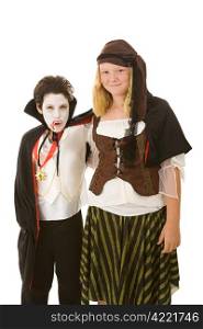 Brother and sister dressed in their halloween costumes. Isolated on white.