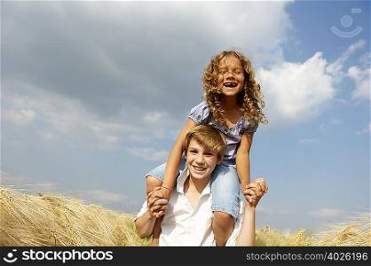 Brother and sister in a wheat field