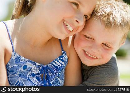 Brother and sister laughing together