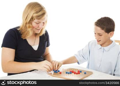 Brother and sister playing a game of chinese checkers (this is a generic game, not a brand name). White background.