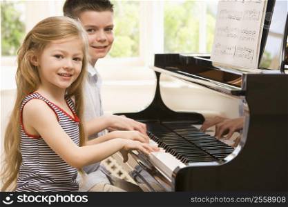 Brother And Sister Playing Piano