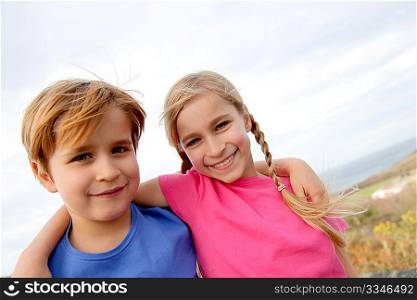 Brother and sister portrait in summer time