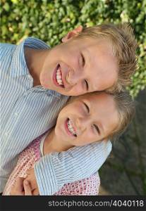 Brother and sister smiling, portrait