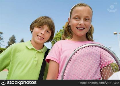 Brother and Sister with Tennis Racket