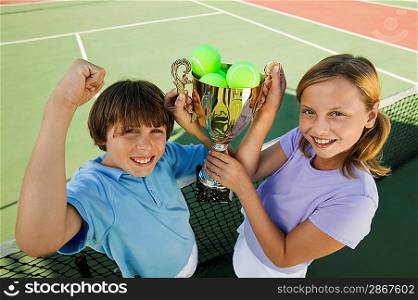 Brother and Sister with Tennis Trophy